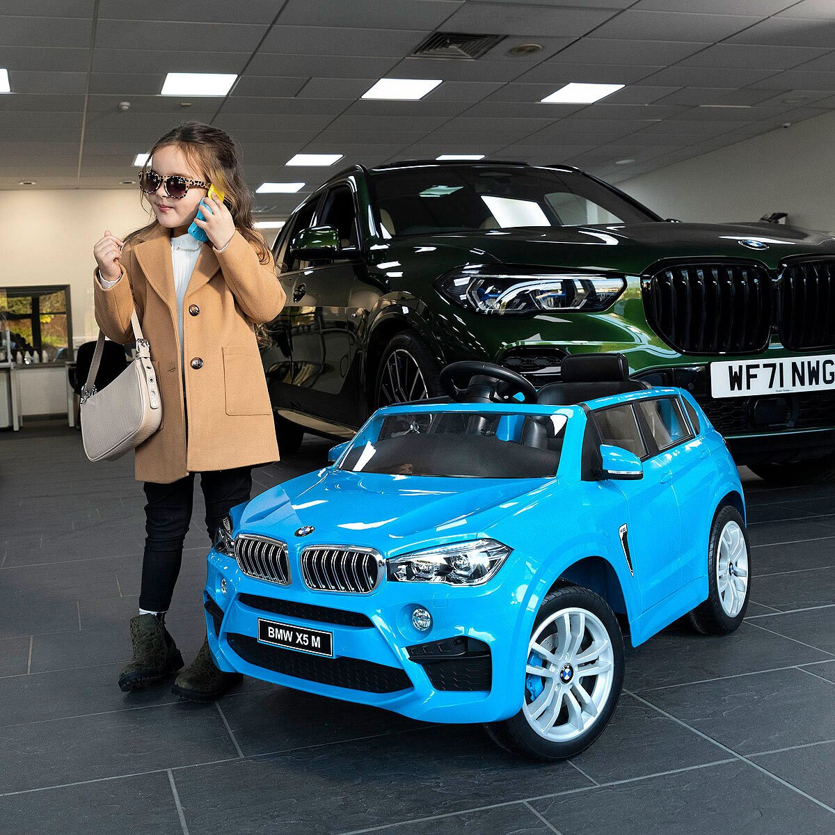 Buy Xootz BMW X5 12V Electric Ride On Blue Lifestyle Image at Costco.co.uk