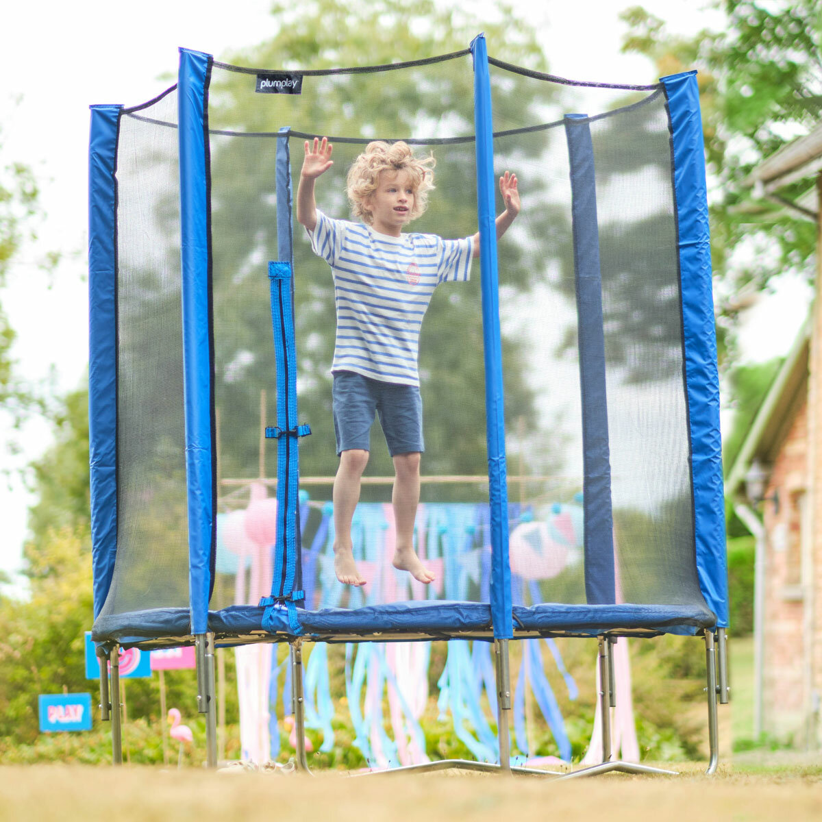 Lifestyle image of a child jumping on the trampoline