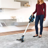 Lifestyle image of woman vacuuming with SR100