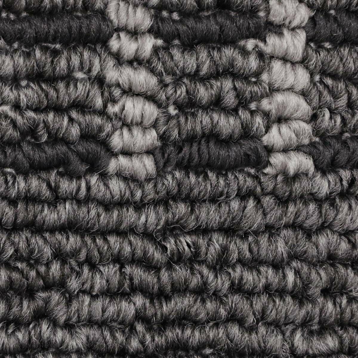 Close up of runner rug with grey geometric pattern