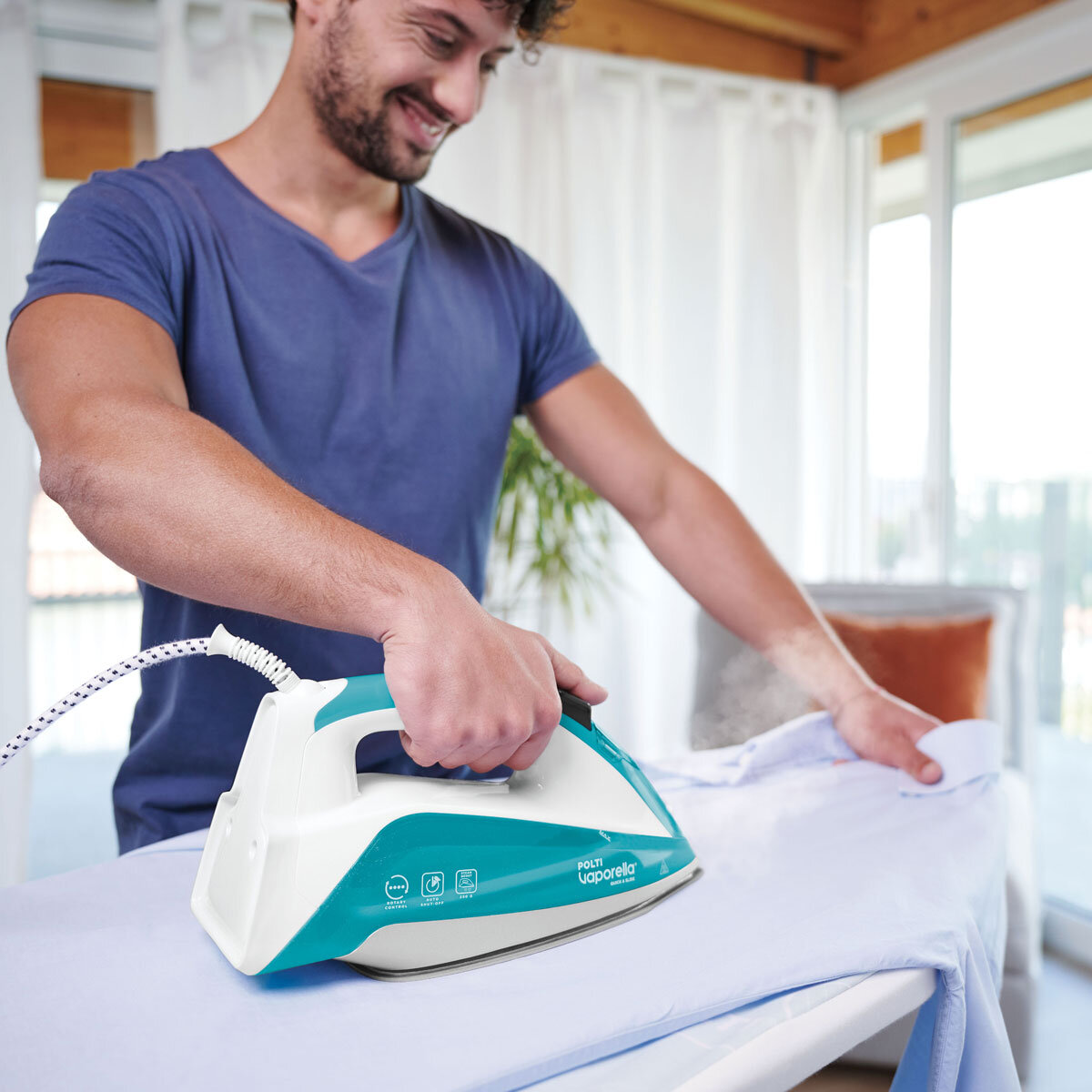 Lifestyle Image of man ironing with Polti Vaporella QS210