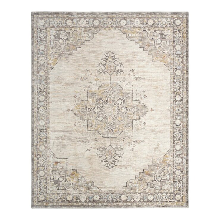 Beige and grey rug with central medallion and ornate symmetrical pattern