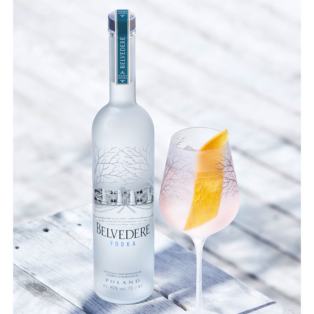 Lifestyle image of vodka bottle with cocktail