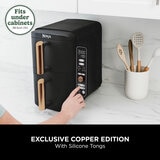 Lifestyle image of Ninja Double Stack 9.5L Air Fryer fitting under kitchen cabinets