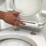 Lifestyle image of toilet seat showing easy removal system