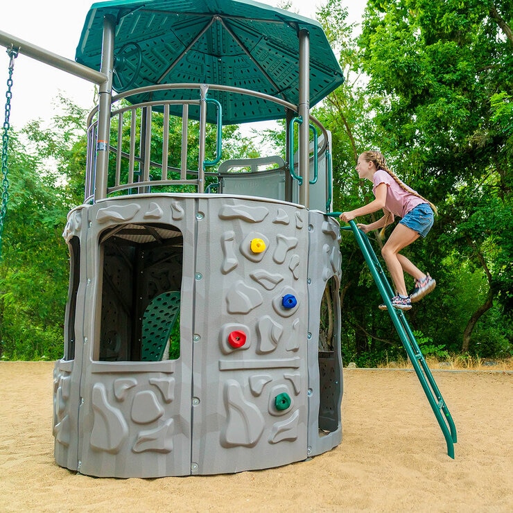 Lifestyle image of a child climbing the ladder