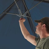 Lifestyle image of someone setting up the canopy