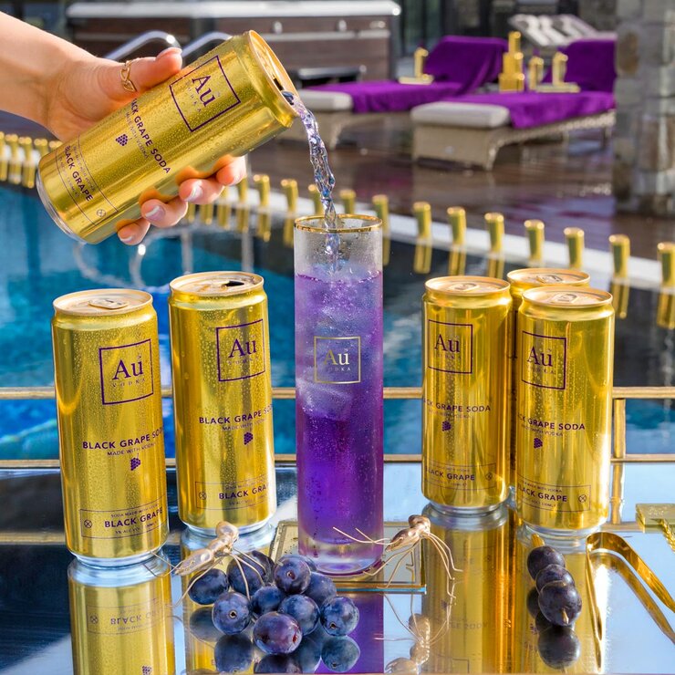 Cans next to a glass