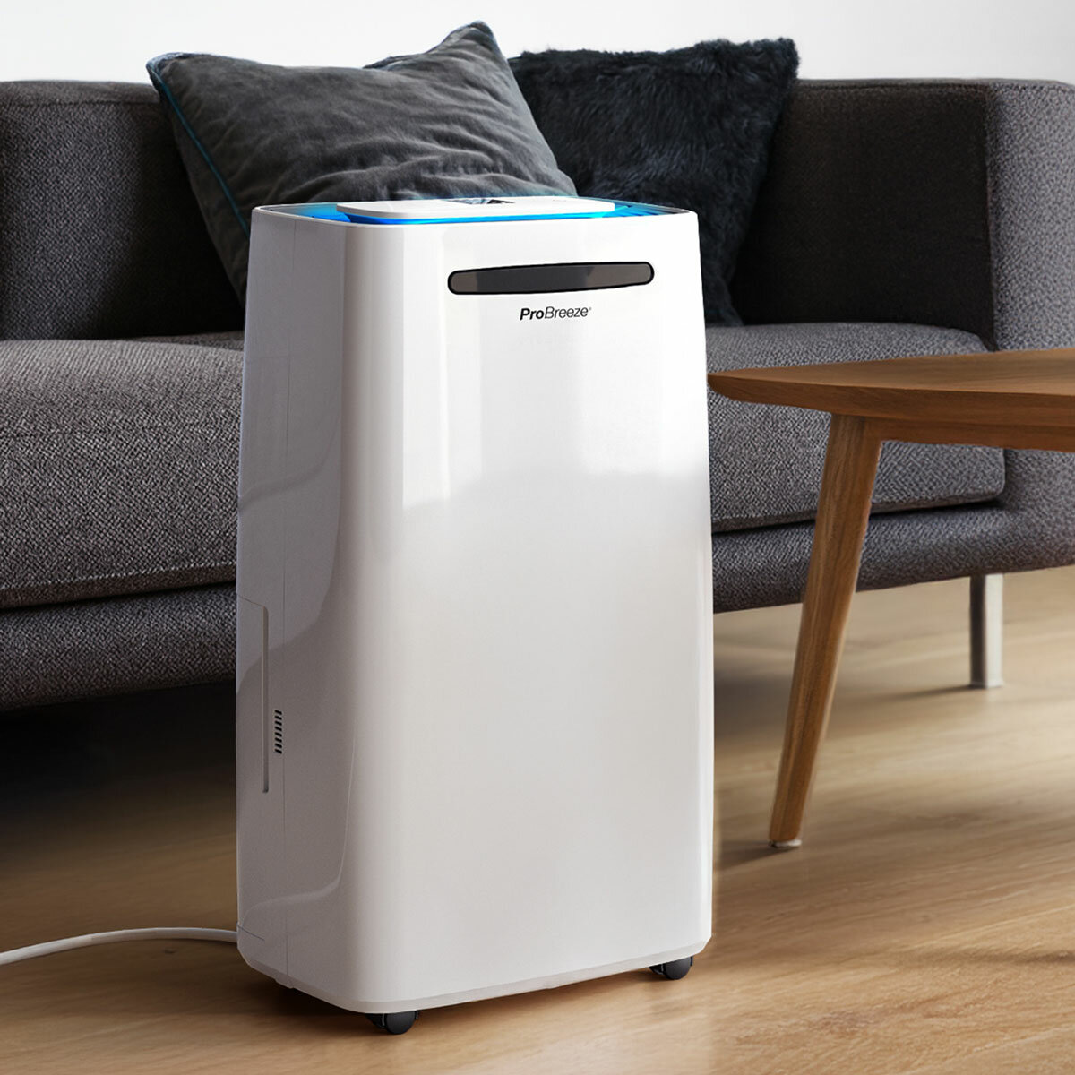Lifestyle image of f Pro Breeze 20L Dehumidifier with Max Extraction, Laundry Mode and Smart App Control in a living room