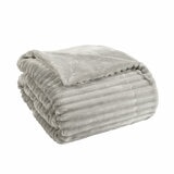 Plain background imagery of light grey ribbed throw folded Plain background imagery of light grey ribbed throw folded