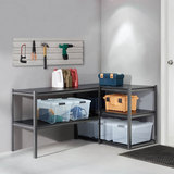 Shelve in a garage setting with neutral walls in a L shape with Tools above