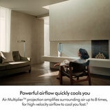 Lifestyle image of Dyson AM15 in a living room with powerful airflow