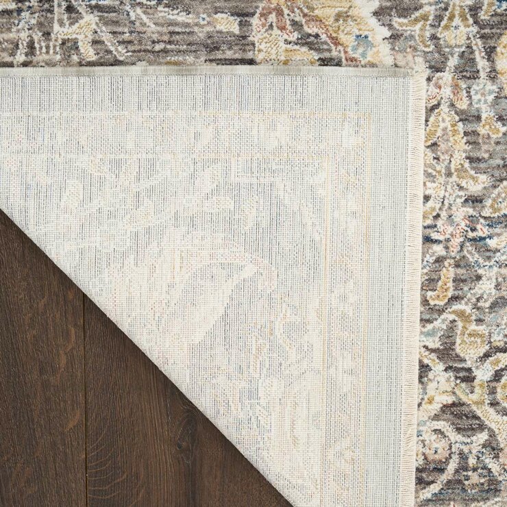 Grey and beige rug with detailed symmetrical pattern and vintage-style accents