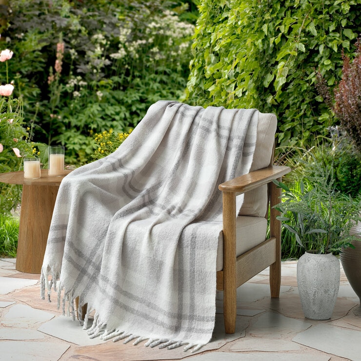 Grey throw draped on chair