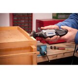 lifestyle image of multi-tool sanding wood