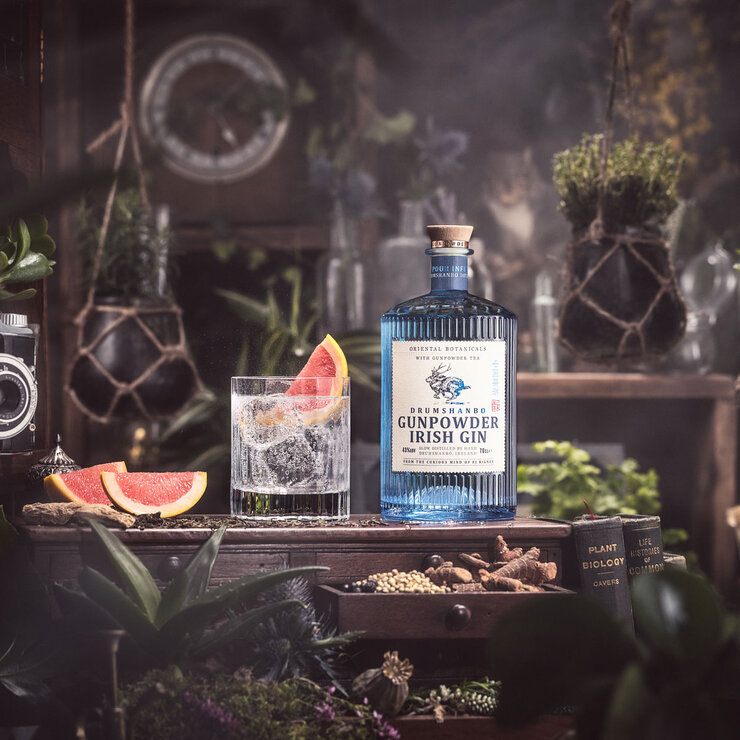 Drumshanbo Gunpowder Gin, with glass surrounded by plants Drumshanbo Gunpowder Gin, with glass surrounded by plants
