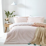 Pink and white vertically striped duvet set with matching pillowcases.