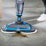 Lifestyle image of Bissell Spinwave cleaning up coffee stain