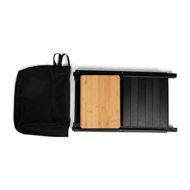 Studio image of the unit folded down, next to the carry bag