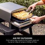 Lifestyle image showing air frying outdoors Lifestyle image showing air frying outdoors