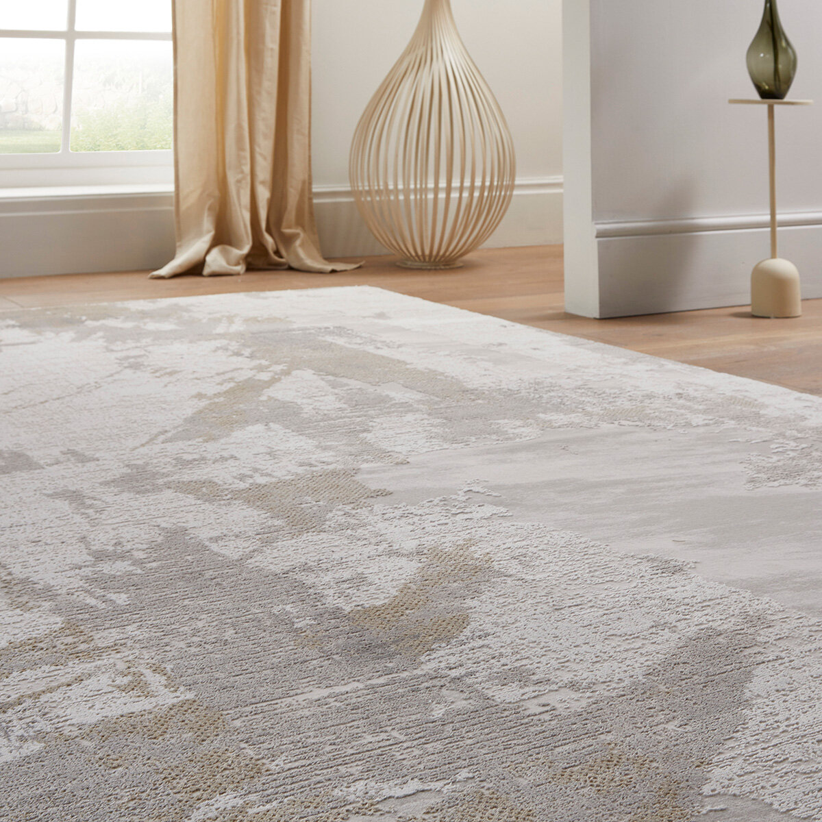 Textured rug in white, beige and light grey with abstract pattern, styled in a minimalist interior.