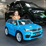 Buy Xootz BMW X5 12V Electric Ride On Blue Lifestyle Image at Costco.co.uk