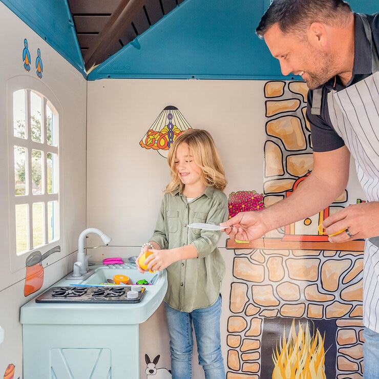 Lifestyle image of a child and adult playing with the sink