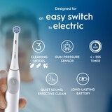 Lifestyle image of Oral-B iO2 Electric Toothbrush with easy switch