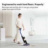 Lifestyle images of Dyson WashG1 wet floor cleaner being used on hard floor