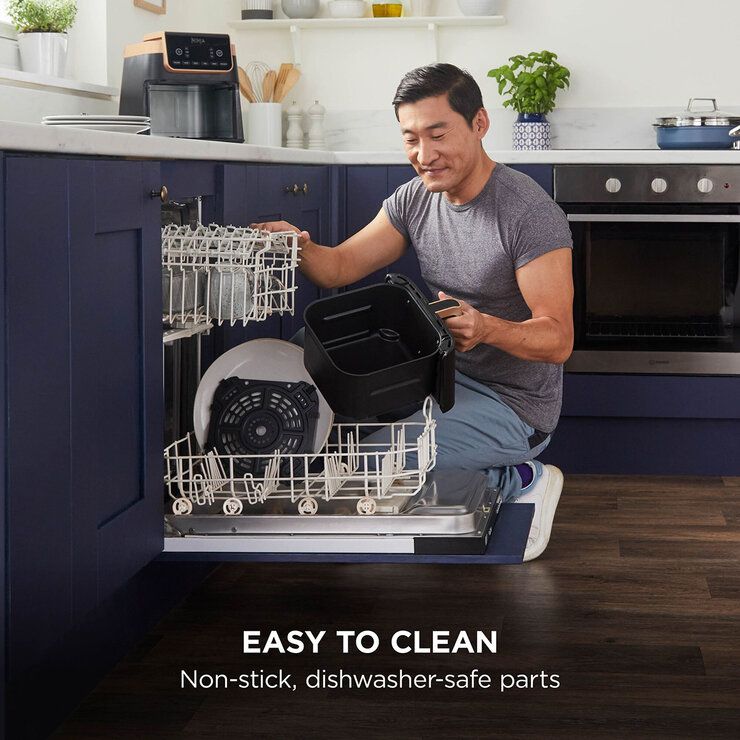 Lifestyle image of model putting dishwasher safe parts into dishwasher