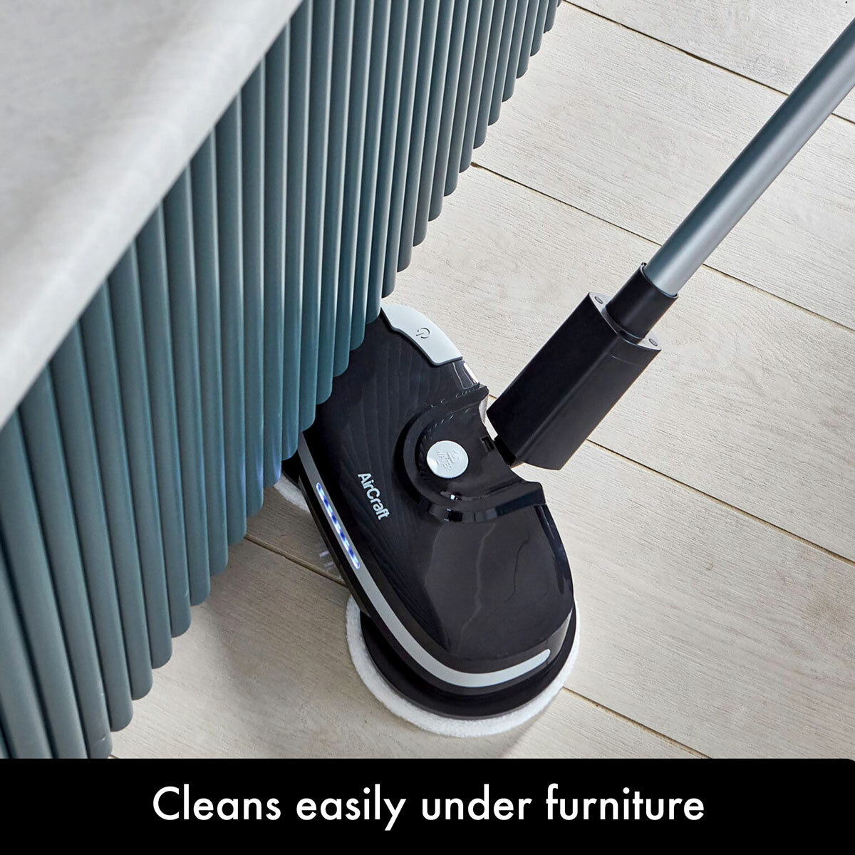 Lifestyle image of PowerGlide cleaning eaily under furniture Lifestyle image of PowerGlide cleaning eaily under furniture