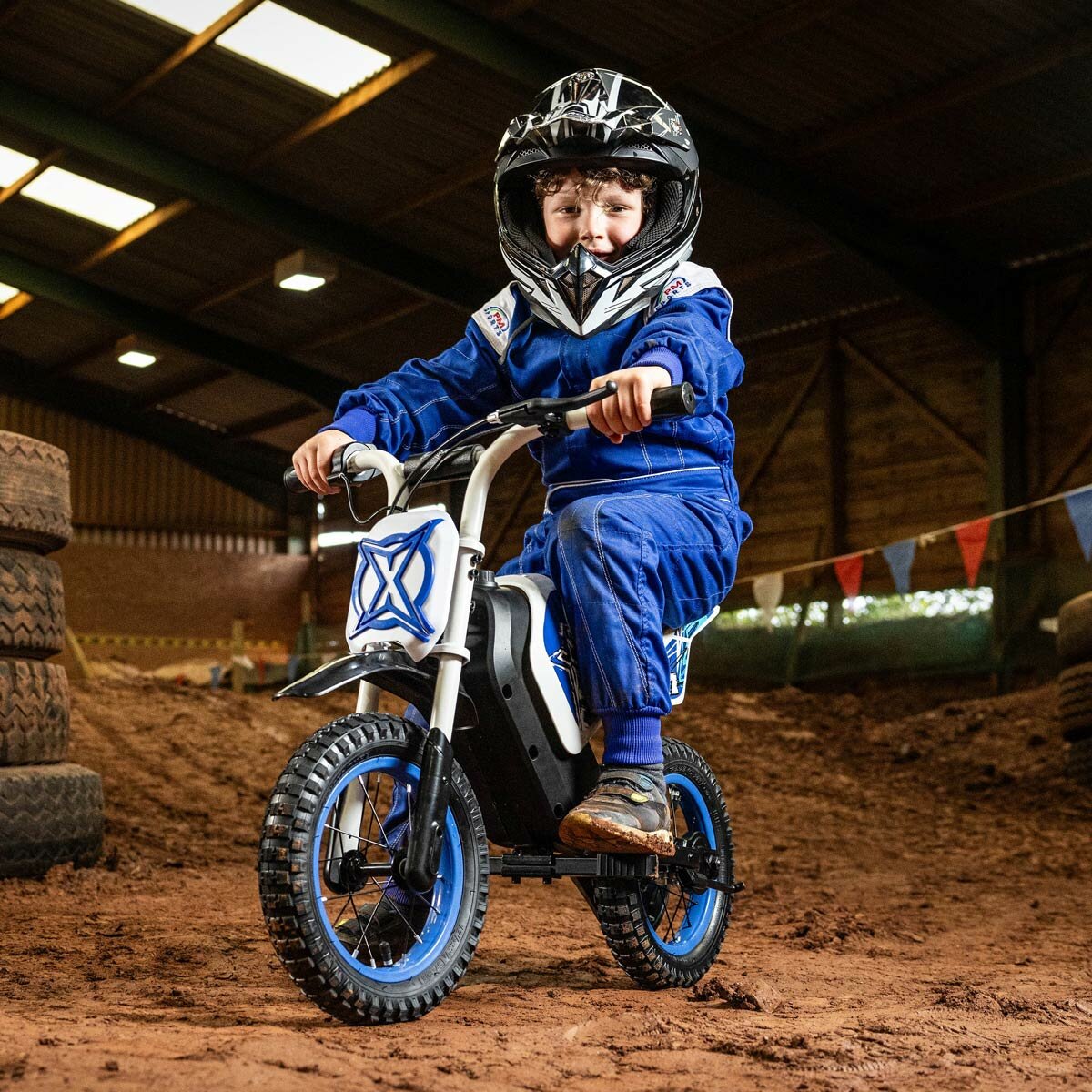 Lifestyle image of a child on the Xootz Cobolt Kids Electric Motorbike