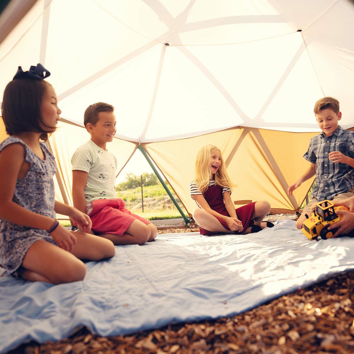 Lifestyle image of children sat under the Dome Climber with the canopy on Lifestyle image of children sat under the Dome Climber with the canopy on