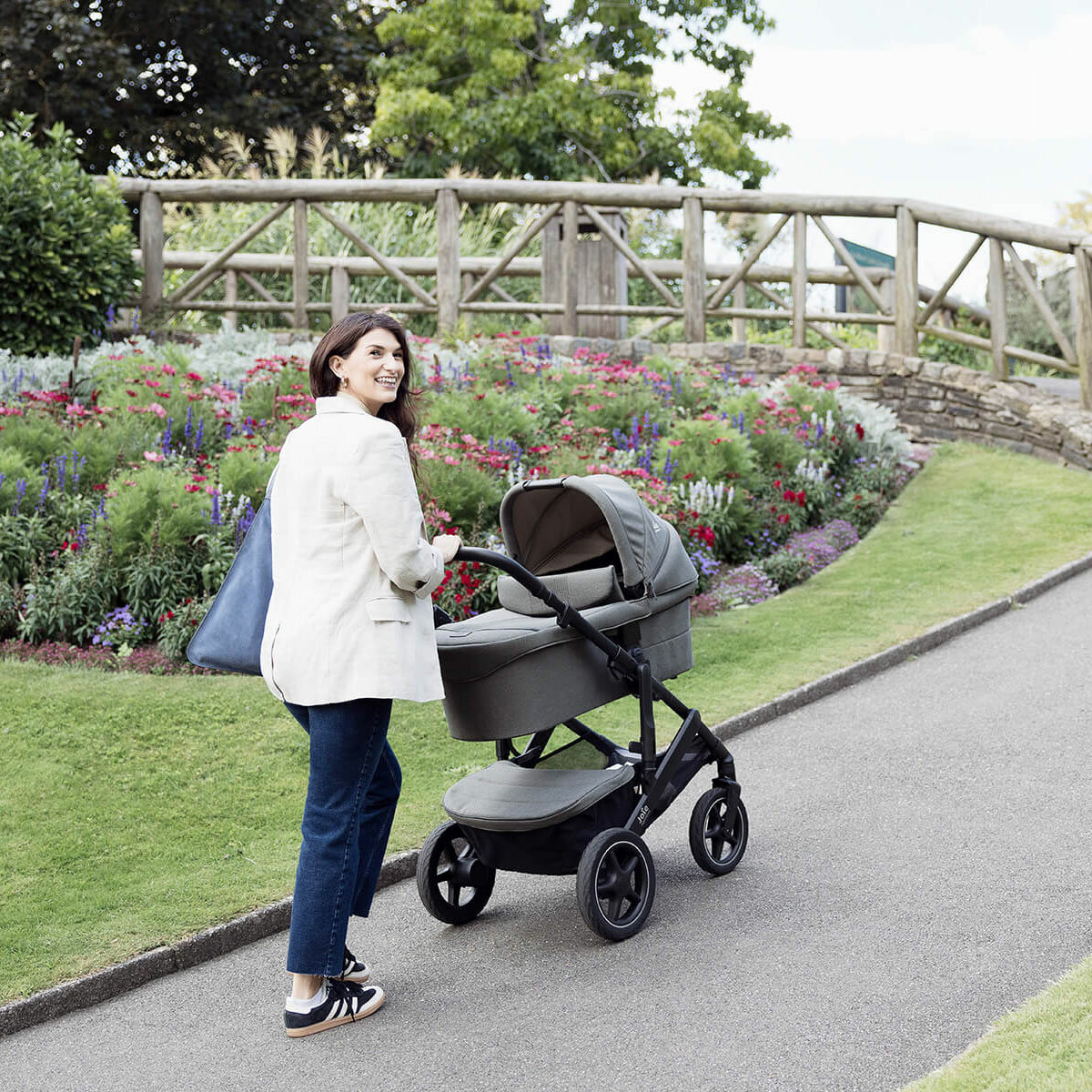 Lifestyle image of a woman pushing the stroller