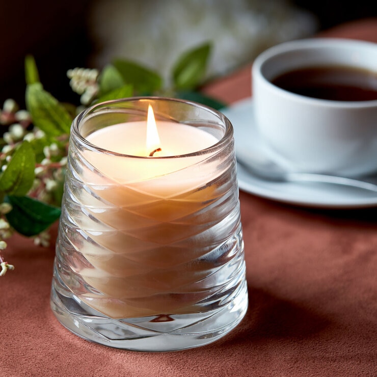 Lifestlye image of candle in clear glass