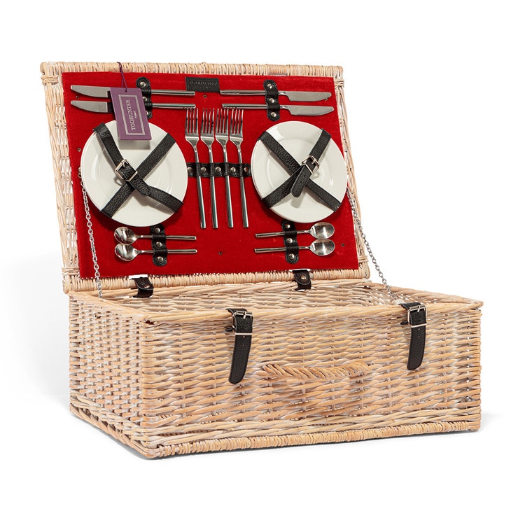 basket open to show plates and cutlery basket open to show plates and cutlery