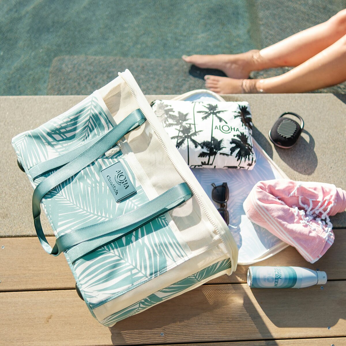 Lifestyle image of the back on the floor with items coming out of it Lifestyle image of the back on the floor with items coming out of it