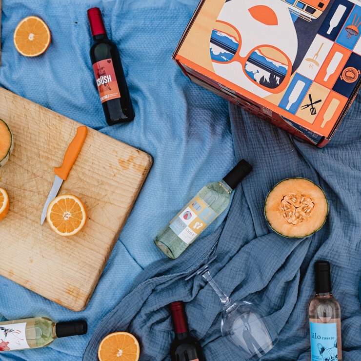 Lifestyle image of bottles out of box on blanket Lifestyle image of bottles out of box on blanket