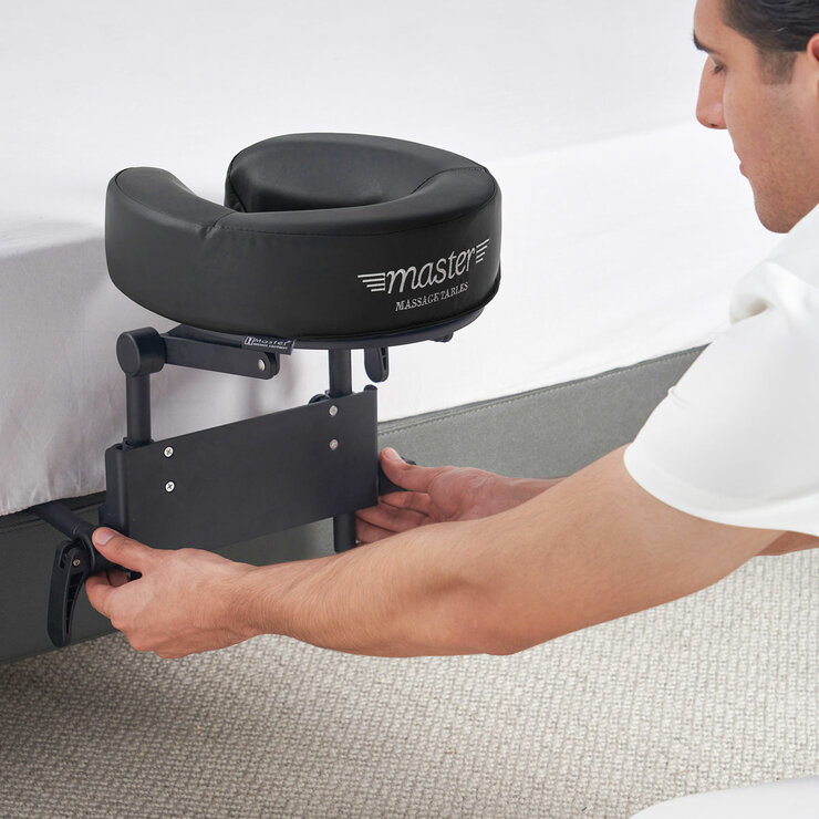 Lifestyle image of someone attaching the massage kit to a mattress