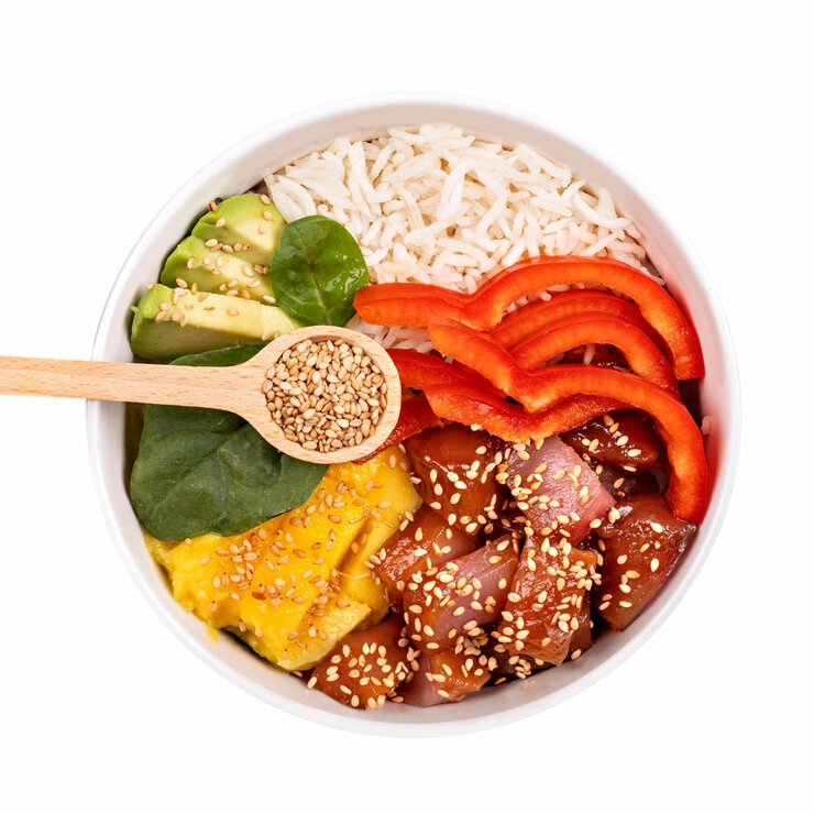 Lifestyle picture of sesame seeds over salad bowl