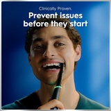 Lifestyle image of model using toothbrush