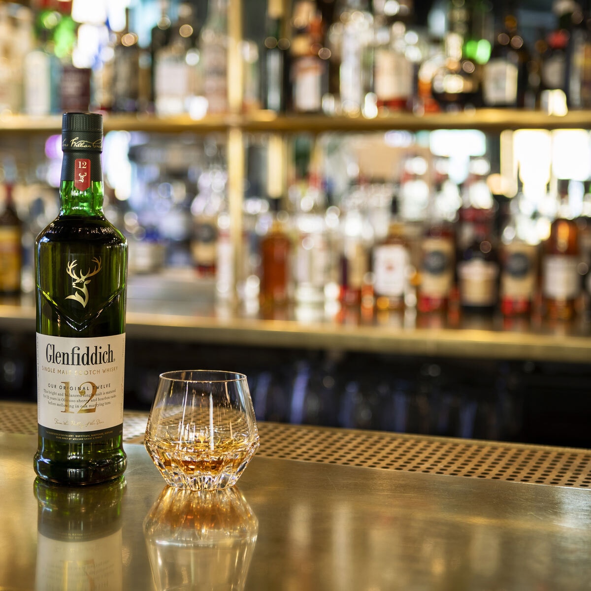 Lifestyle image of bottle on top of bar counter