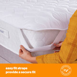 silent night topper on mattersus shwoing the easy elastic latch to secure it to you mattress