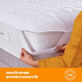 silent night topper on mattersus shwoing the easy elastic latch to secure it to you mattress