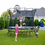 A lifestyle image of children playing on the Springfree 10ft Round Jumbo Trampoline