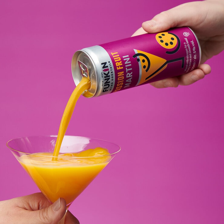 Funkin Passion Fruit Martini being poured into a martini glass
