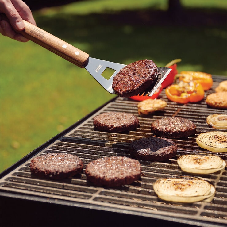 Lifestyle image of spatula utensil on bbq