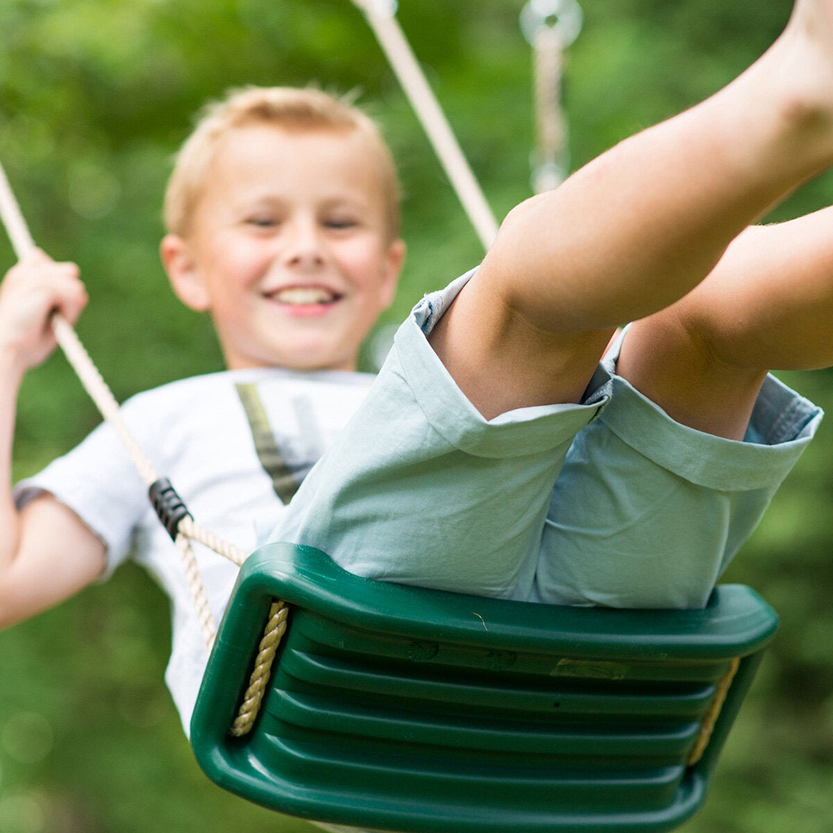 A lifestyle image of a child on the swing A lifestyle image of a child on the swing