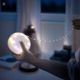 Lifestyle image showing the string lights illuminated