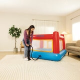 Lifestyle image of a woman inflating the Jump-O-Lene